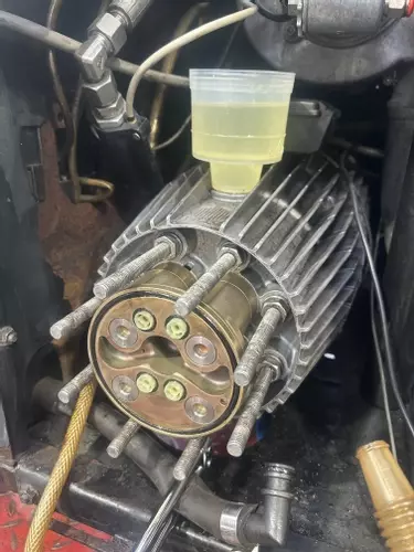 Full refurbishment carried out on the C3 pump assembly during servicing work on a heavily used Nilfisk Neptune 7. The pump was stripped down, inspected for wear, rebuilt with new valves and seals, and refilled with fresh oil ready for continued heavy-duty